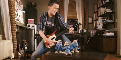 Patrick Winslow Playing The Guitar Behind Gutsy, Brainy And Clumsy